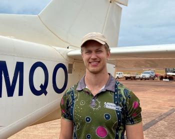 Man standing in front of plane