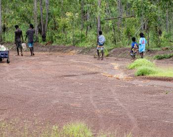 Yolngu folk walking back from the airstrip to their homeland.