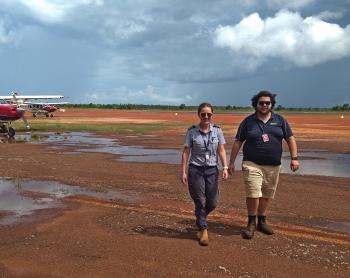 Pilot and ops officer walking to hangar