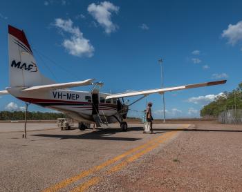 Cessna caravan on concrete tarmac in bright sunlight 