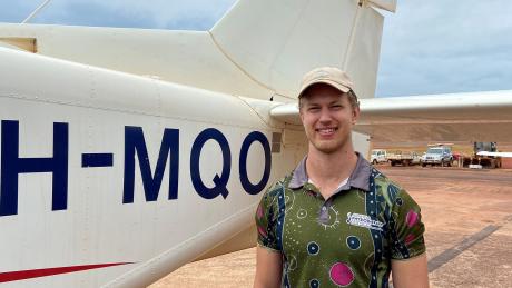 Man standing in front of plane