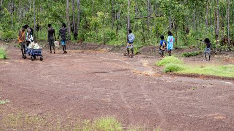 Yolngu folk walking back from the airstrip to their homeland.