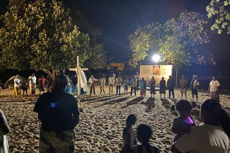 Nighttime revival gathering on beach