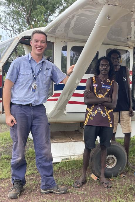 Laynhapuy Homelands School students Yalanba and Vernon with VH-MQR pilot Matthew Kaye in the Arnhem Land community of Gurrumuru.