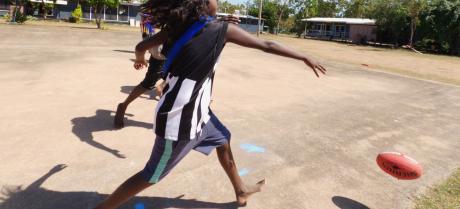 students playing football