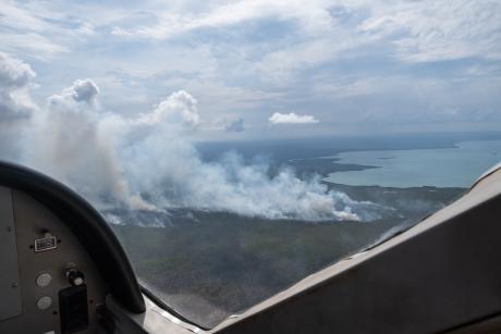 Aerial view of bush fire smoke seen from aircraft window