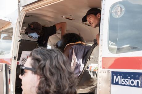 People peering out of aircraft