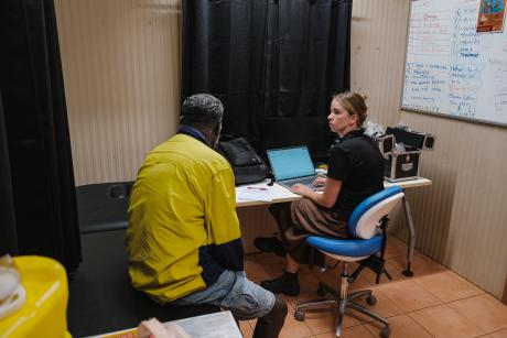 patient and nurse in clinic room