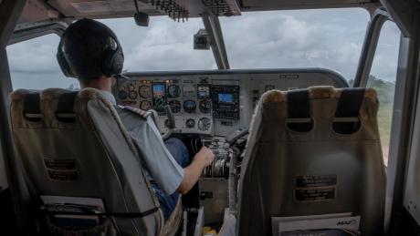 pilot in cockpit of aircraft