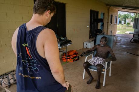 physiotherapist working with patient