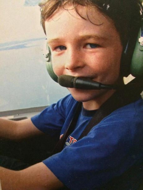 Young boy in aircraft cockpit