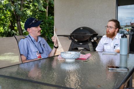 Flight instructor and student at table 