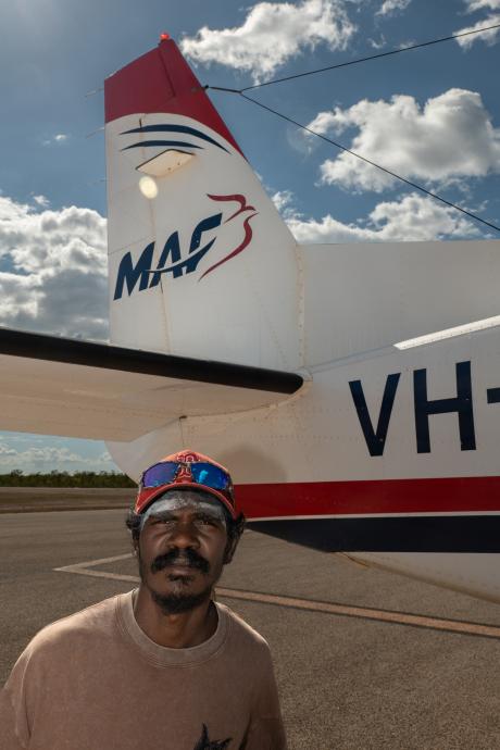Man standing in front of aircraft